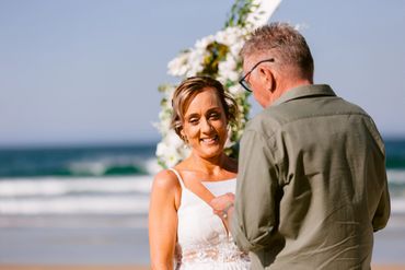 A couple exchanging vows at a beach wedding ceremony.
Stylist @cloudnineweddings
Hair @rollingscissors