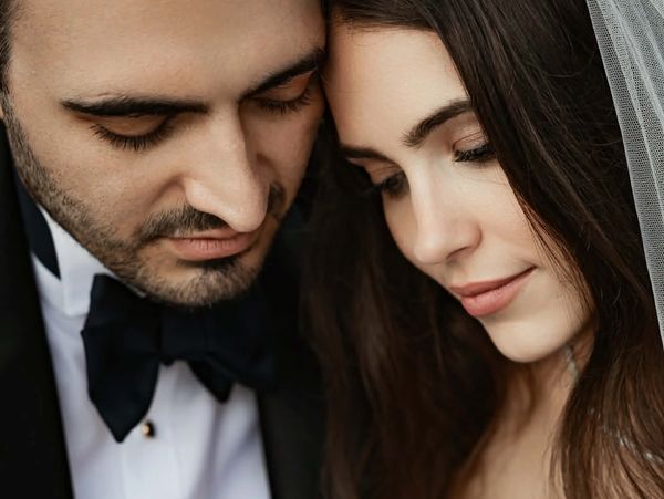 Close-up of a bride and groom tenderly holding hands on their wedding day
Photography by https://benconnolly.com.au/