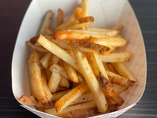 hot fresh french fries on table