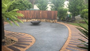 Fire Pit Area with sleepers and stone in Beaconsfield Upper