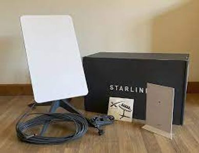 Starlink satellite internet kit with antenna, cables, and router.