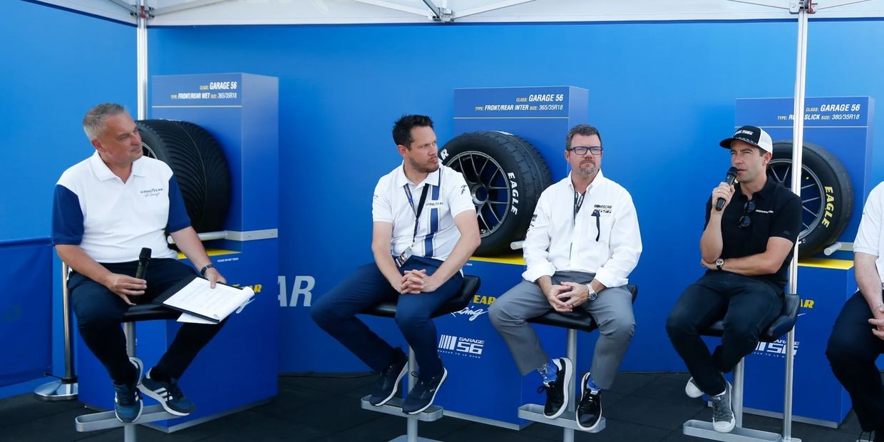 Four industry panellists are having a discussion at an event.