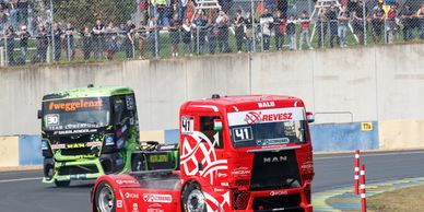 Two trucks on a racetrack