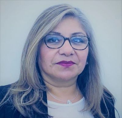 Woman wearing a blazer and glasses