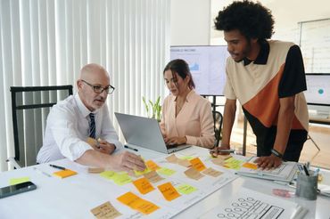 Team collaborating with sticky notes