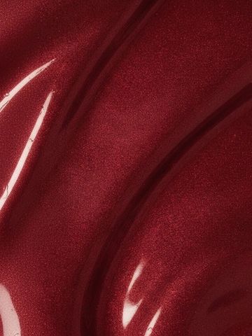 Glossy, shimmering deep red liquid or paint texture with flowing curves.