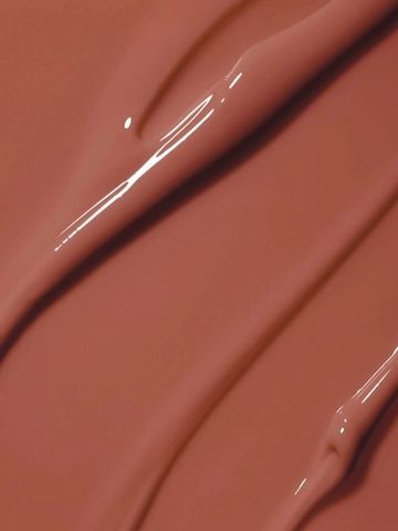 Close-up of smooth, glossy brown liquid or cream texture.