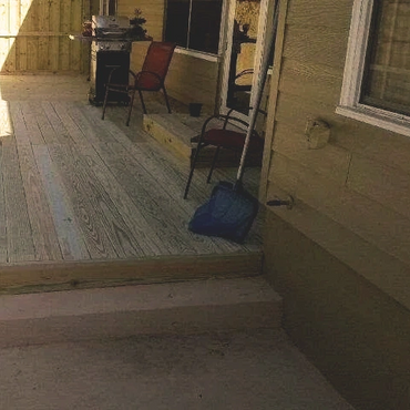 Steps to a deck that was built for the exterior door