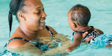The Swim Center instructor teaches mom and baby babies water safety in McDonough GA Henry county