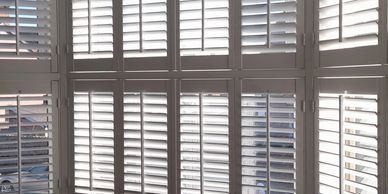 Made to measure shutters with central rod. These made to measure by alize shutters.