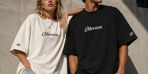 Two models wearing oversized black and white t-shirts with 'OtherSide' text.