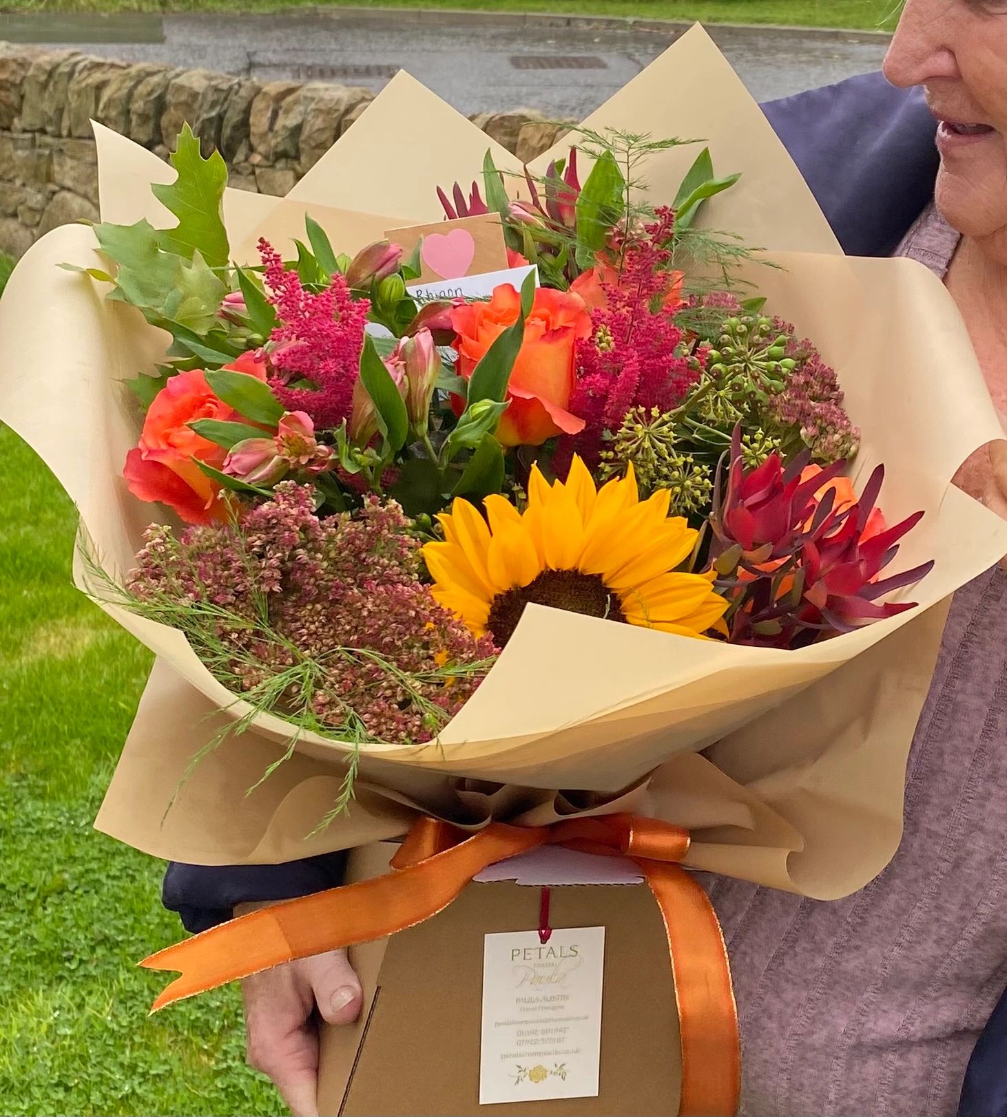 Bright autumnal bouquet with sunflowers, roses and sedum delivered personally to our happy customers