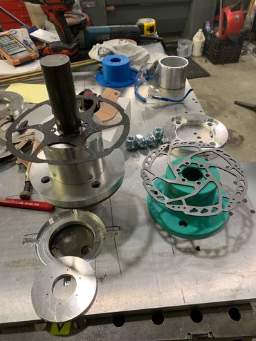 3D printed hub for R&D on a powered chariot style camera rig. Left item is start of actual hub