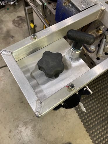 Underside of RBQ mounted on swivel plate for cart.