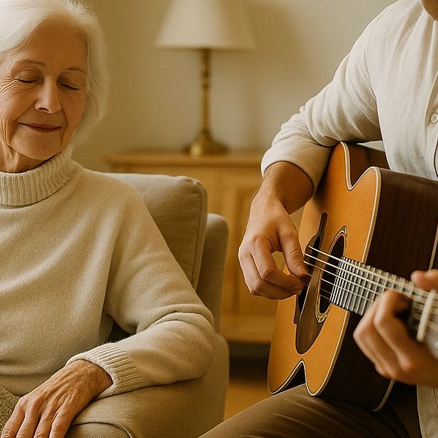 Charlie Hodgson playing calming acoustic guitar for elderly person with dementia home Hertfordshire