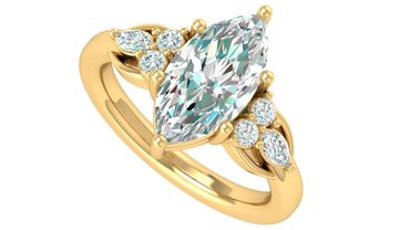 Elegant gold ring with a marquise-cut central diamond and smaller accent diamonds.