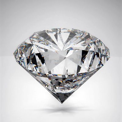 A sparkling, cut diamond with multiple facets on a gray background.