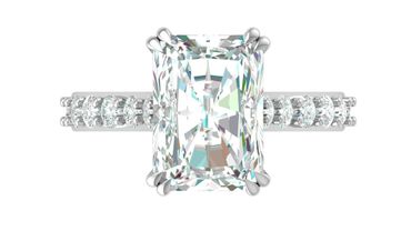 Elegant diamond ring with a large rectangular center stone and smaller stones on the band.