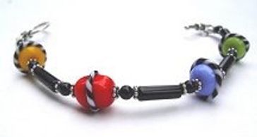 A beaded bracelet with yellow, red, blue, and green beads