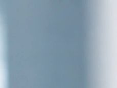 Blurred gradient from blue to white.