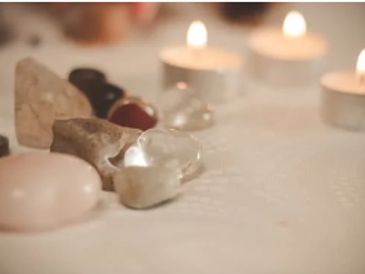 crystals with candle lit in background