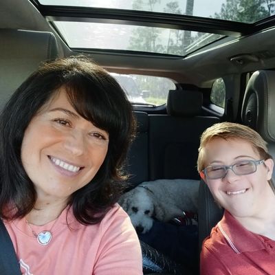 Cynthia Sharpe with her son and service dog, Marshmellow.