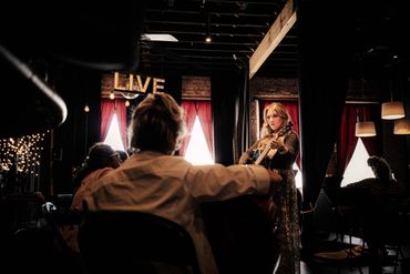 This is a picture of the back of one of Ashlee’s students showing Ashlee looking on demonstrating