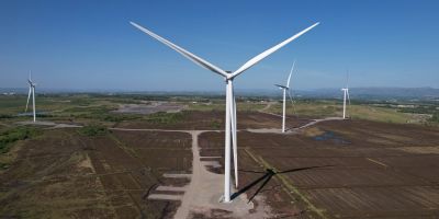 Aerial drone image of wind turbines at a wind farm in Scotland, captured during a commercial wind tu