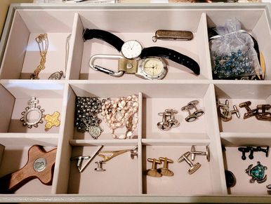 Drawer organizer for jewelry including rings, bracelets, earrings, and necklaces in separate compart