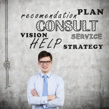 Confident young man in business attire stands before a wall with consulting keywords.