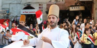 a man dancing in front of people