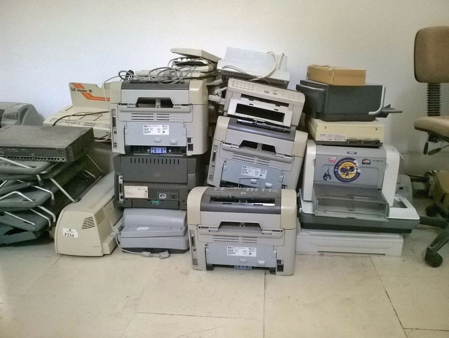 A pile of old printers
