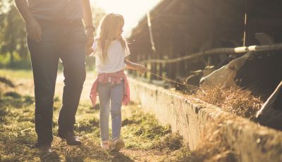 Parent and child on a farm