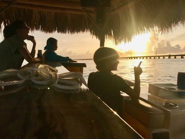 tiki boat adventures sunset view