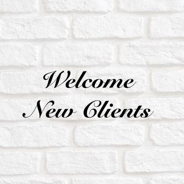 Welcome New Clients text on white brick wall.