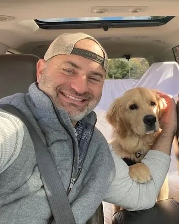Craig with his Golden Retriever, Cooper.