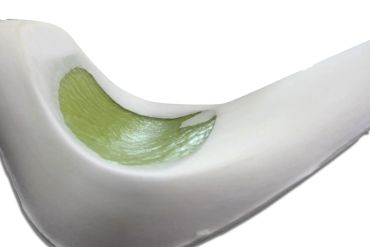 Close-up of a white flower petal with a green central vein.