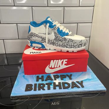 Realistic Nike Air Max sneaker cake with birthday message.