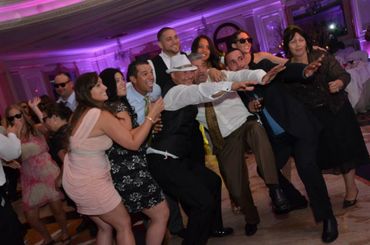 Group of people striking a fun pose at a lively party.