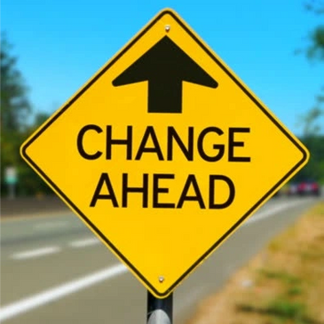 Yellow "Change Ahead" road warning sign.