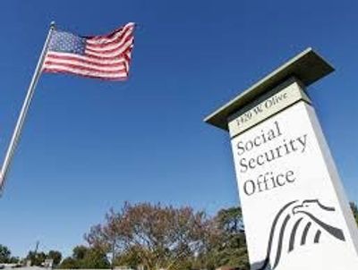 Social Security Office sign with American flag.