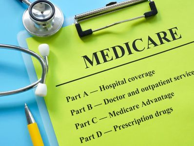 Medicare information sheet with stethoscope and pen.