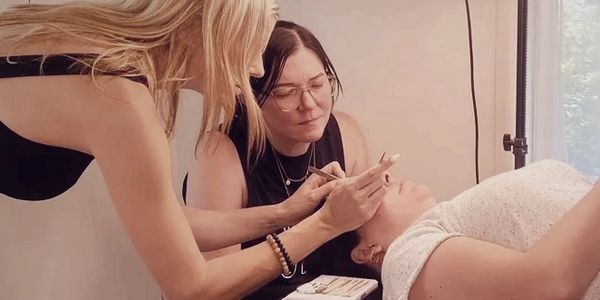 Jess demonstrating the application of lash extensions for a student