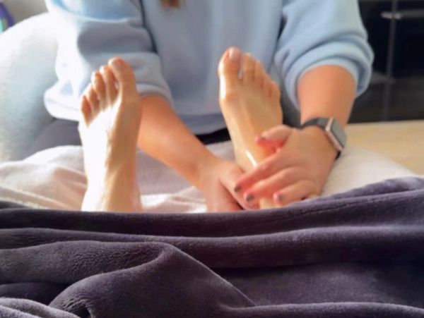 Person giving a foot massage.