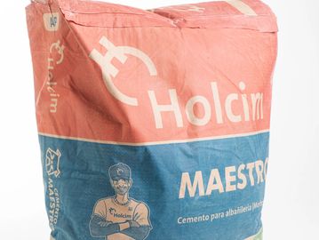 A bag of Holcim Maestro cement for masonry work.