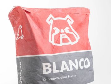 A bag of Blanco Portland cement with a bulldog logo.