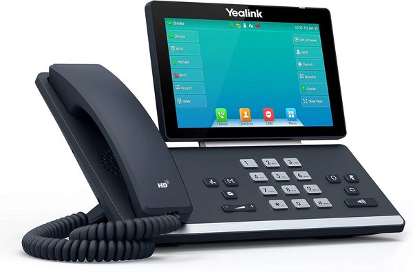 Modern Yealink office phone with touchscreen and multiple function keys. A Yealink VoIP desk phone featuring a high-resolution color display, HD audio, and intuitive controls, designed for clear, reliable business communication over broadband or cloud-based systems.