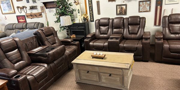 Leather reclining sofa and loveseat by Ashley