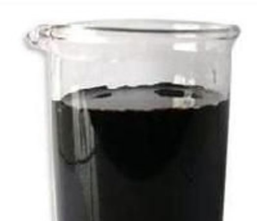 A beaker filled with a thick black liquid.