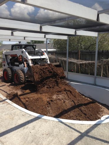 old pool being filled in with fill dirt